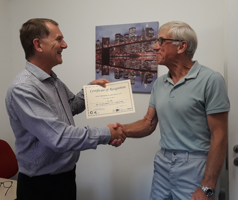Frank, one of our Volunteers, receiving a Certificate for long service
